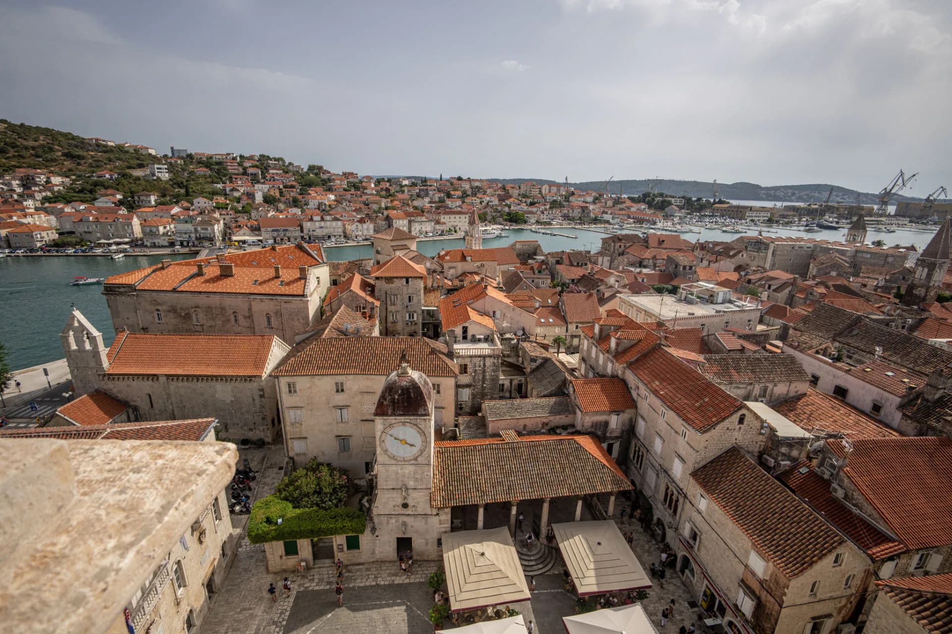 Trogir old town from the cathedral bell tower, with the clock tower, loggia and channel, near Split.